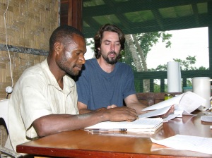Rocky Dede and Roland Maiyena work on the Pouye translation in PNG